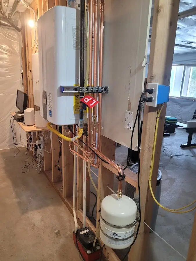Licensed plumber repairing a kitchen sink in New York